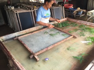 Inserting Bamboo leaves into handmade paper 
