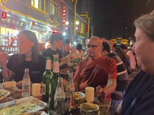 Anita, Anil and Kelly at dinner