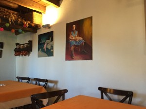 Artwork hanging in the Albergue Bar