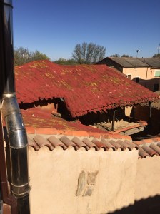Colourful roof behind albergue